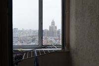 Релоканты. Фотопроект о мужчинах, уехавших в Казахстан после начала мобилизации, Вид на Астану из съемной квартиры Олега — миниатюра
